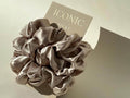 Save yourself from hair breakage and knots and allow our silky scrunchies to improve the quality of your hair's life! We use the highest quality (6A) 100% Mulberry silk that helps to ensure your endless experience. Antibacterial, hypoallergenic, and Hyaluronic Acid infused scrunchies.