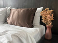 Get the beauty sleep you deserve with our Hyaluronic Acid Infused Silk Pillowcase. The silky smooth fabric is gentle on your skin and hair while the infused hyaluronic acid provides hydration, leaving you with a refreshed and rejuvenated complexion. Say goodbye to bed head and wake up to a glowing complexion every morning.