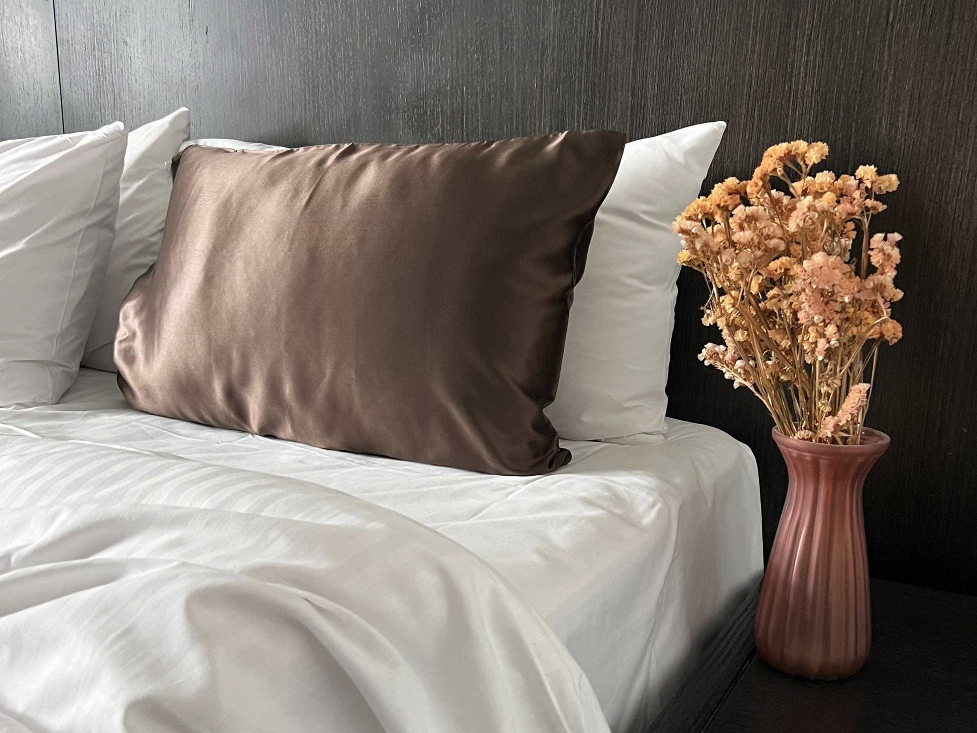 Get the beauty sleep you deserve with our Hyaluronic Acid Infused Silk Pillowcase. The silky smooth fabric is gentle on your skin and hair while the infused hyaluronic acid provides hydration, leaving you with a refreshed and rejuvenated complexion. Say goodbye to bed head and wake up to a glowing complexion every morning.